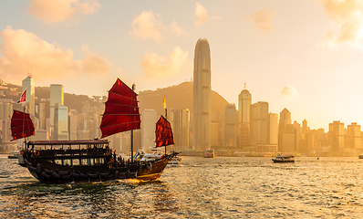 Image showing Chinese wooden red sails ship in Hong Kong Victoria harbor at su
