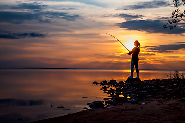 Image showing Woman fishing on Fishing rod spinning in Finland