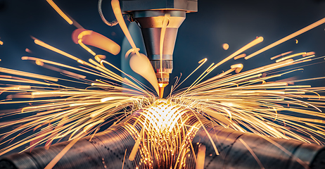 Image showing CNC Laser cutting of metal, modern industrial technology.