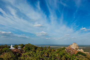 Image showing Meditation rock in Mihintale and Buddha Statue on sunset, Sri Lanka