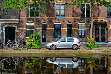 Image showing Cars on canal embankment in street of Delft. Delft, Netherlands