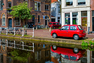 Image showing Cars on canal embankment in street of Delft. Delft, Netherlands