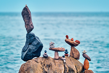 Image showing Concept of balance and harmony - pebble stone stacks on the beach