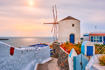 Image showing Old greek windmill on Santorini island in Oia town with stairs in street. Santorini, Greece