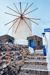 Image showing Old greek windmill on Santorini island in Oia town with stairs in street. Santorini, Greece