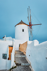 Image showing Old greek windmill on Santorini island in Oia town with stairs in street. Santorini, Greece