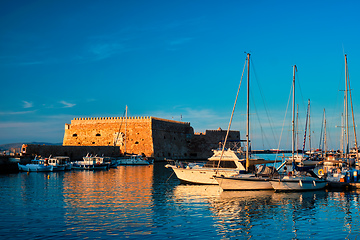 Image showing Venetian Fort in Heraklion and moored fishing boats, Crete Island, Greece