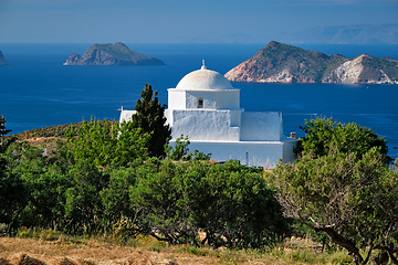 Image showing View of Milos island and Greek Orthodox traditional whitewashed church in Greece