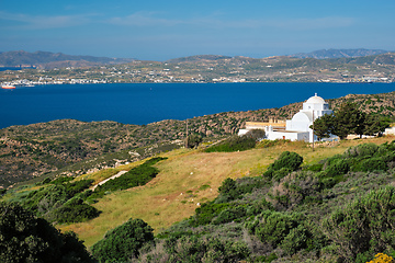 Image showing View of Milos island and Greek Orthodox traditional whitewashed church in Greece