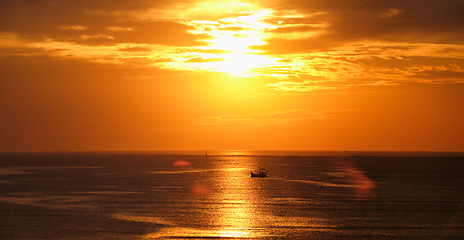 Image showing Sea sunset with boats