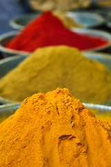 Image showing Turmeric curcuma powder and chili powder in spices market in India