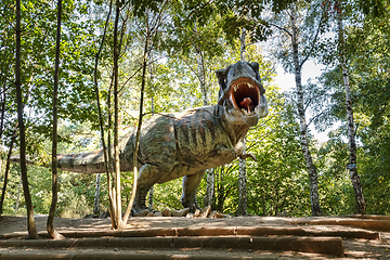 Image showing prehistoric dinosaurs Tyrannosaurus Rex in wildlife