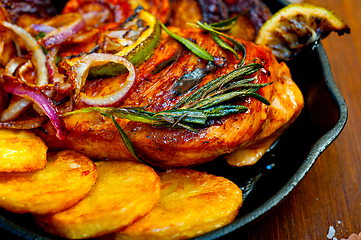 Image showing roasted grilled BBQ chicken breast with herbs and spices