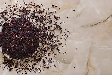 Image showing Dry hibiscus tea in a bowl