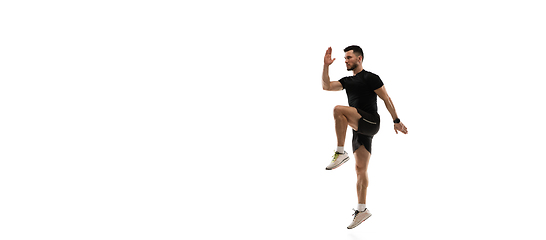 Image showing Caucasian professional sportsman training isolated on white studio background. Muscular, sportive man practicing.