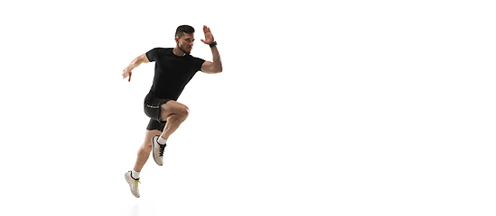 Image showing Caucasian professional sportsman training isolated on white studio background. Muscular, sportive man practicing.