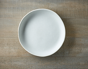 Image showing empty plate on wooden table