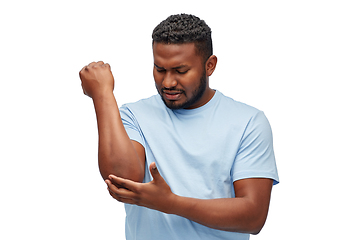 Image showing african american man suffering from pain in hand