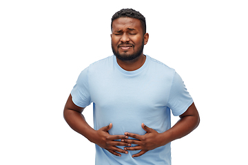 Image showing unhappy man suffering from stomach ache