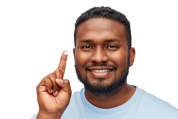 Image showing happy african american man showing moisturizer