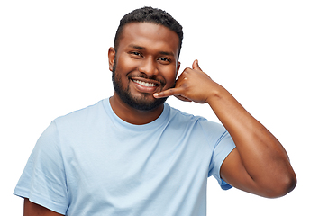 Image showing african american man making phone call gesture