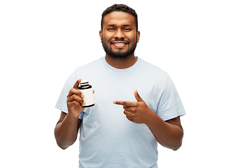 Image showing smiling african american man with medicine jar