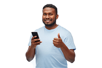 Image showing happy african american man with smartphone