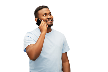 Image showing happy african american man calling on smartphone