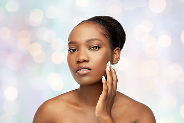 Image showing portrait of african woman touching her face