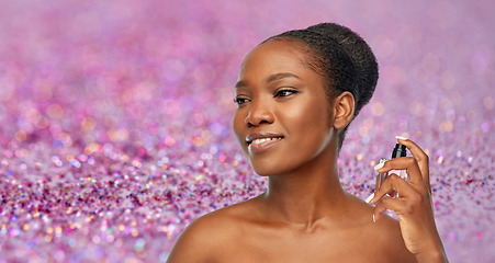 Image showing young african american woman with perfume