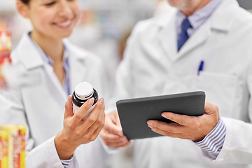 Image showing pharmacists with tablet pc and medicine