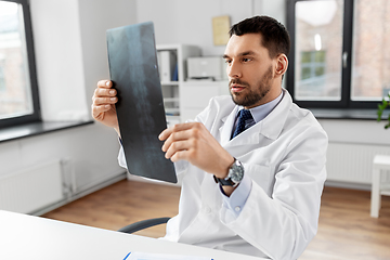 Image showing male doctor with x-ray of spine at hospital