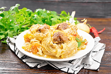 Image showing Pasta with meatballs in plate on wooden board