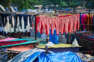 Image showing Dhobi Ghat is an open air laundromat lavoir in Mumbai, India with laundry drying on ropes