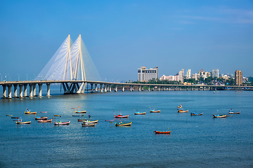 Image showing Bandra - Worli Sea Link bridge with fishing boats view from Bandra fort. Mumbai, India