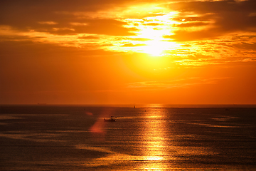 Image showing Sea sunset with boats