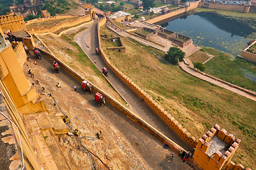 Image showing Tourists riding elephants on ascend to Amer fort