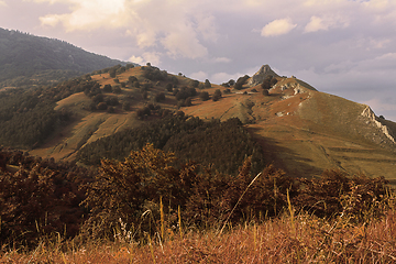 Image showing Orange colors of sunset over hills