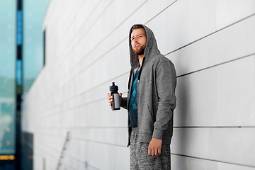 Image showing sportsman with bottle of water in city