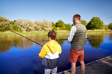 Image showing father and son fishing on river