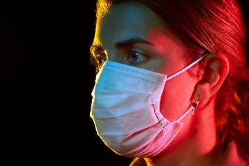 Image showing young woman wearing protective medical mask