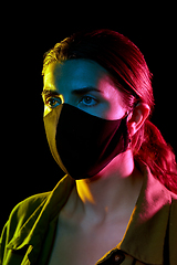 Image showing young woman wearing reusable protective mask