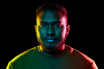 Image showing young african american man over black background