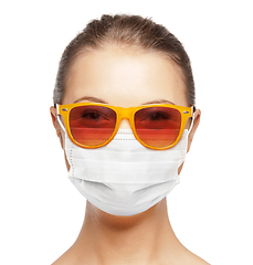 Image showing teenage girl in medical mask and sunglasses