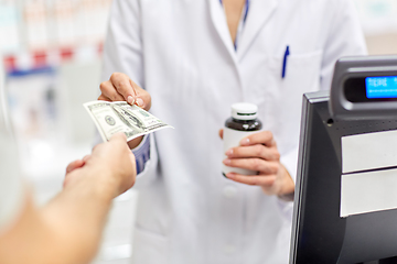 Image showing close up of pharmacist selling drug at pharmacy