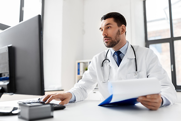 Image showing male doctor with computer working at hospital