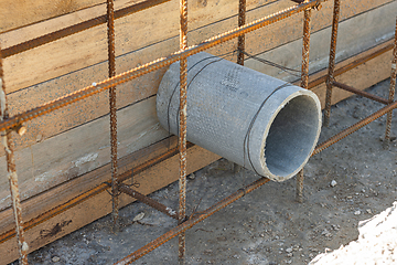 Image showing Sleeve for the withdrawal of communications from an asbestos pipe during the construction of a strip foundation