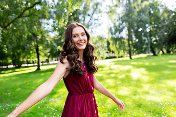 Image showing portrait of happy smiling woman at summer park