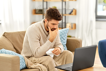 Image showing sick man having video call on laptop at home