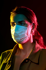 Image showing young woman wearing protective medical mask